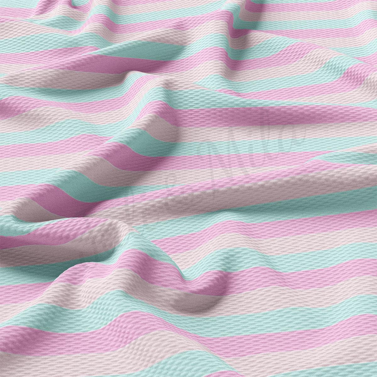 a close up of a pink and blue blanket