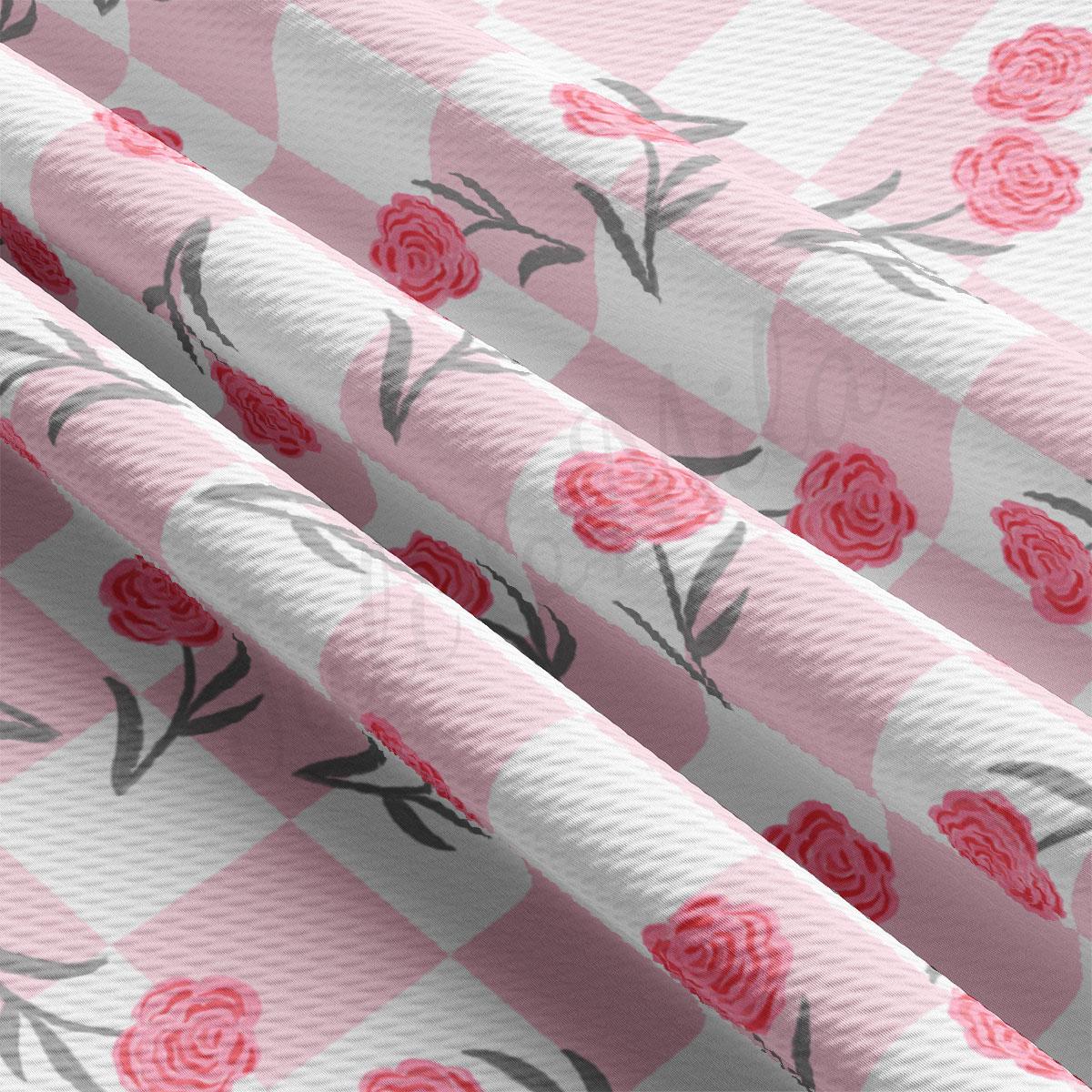 a pink and white wallpaper with roses on it