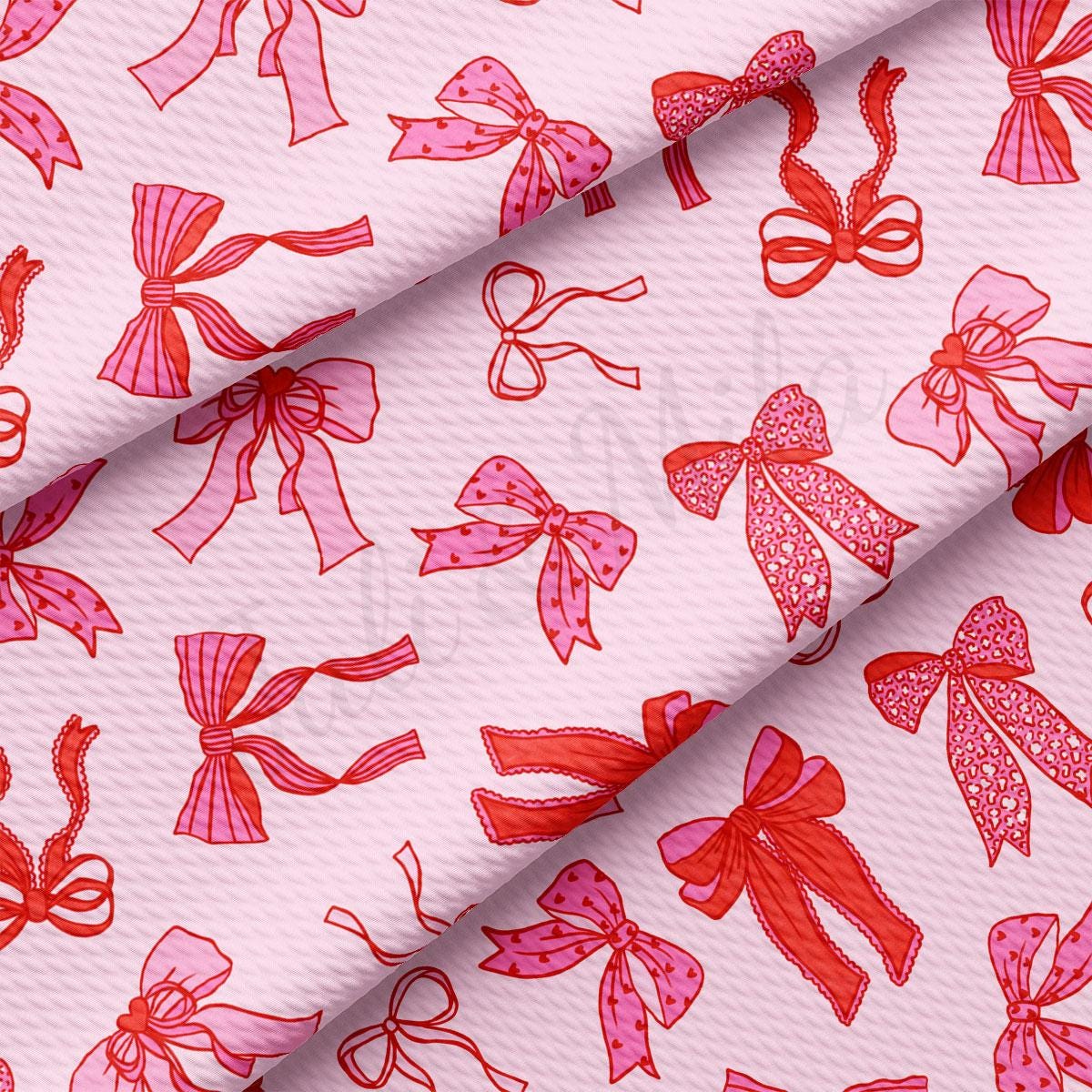 a pink background with red bows on it