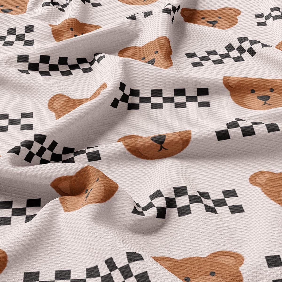 a white fabric with brown dogs on it