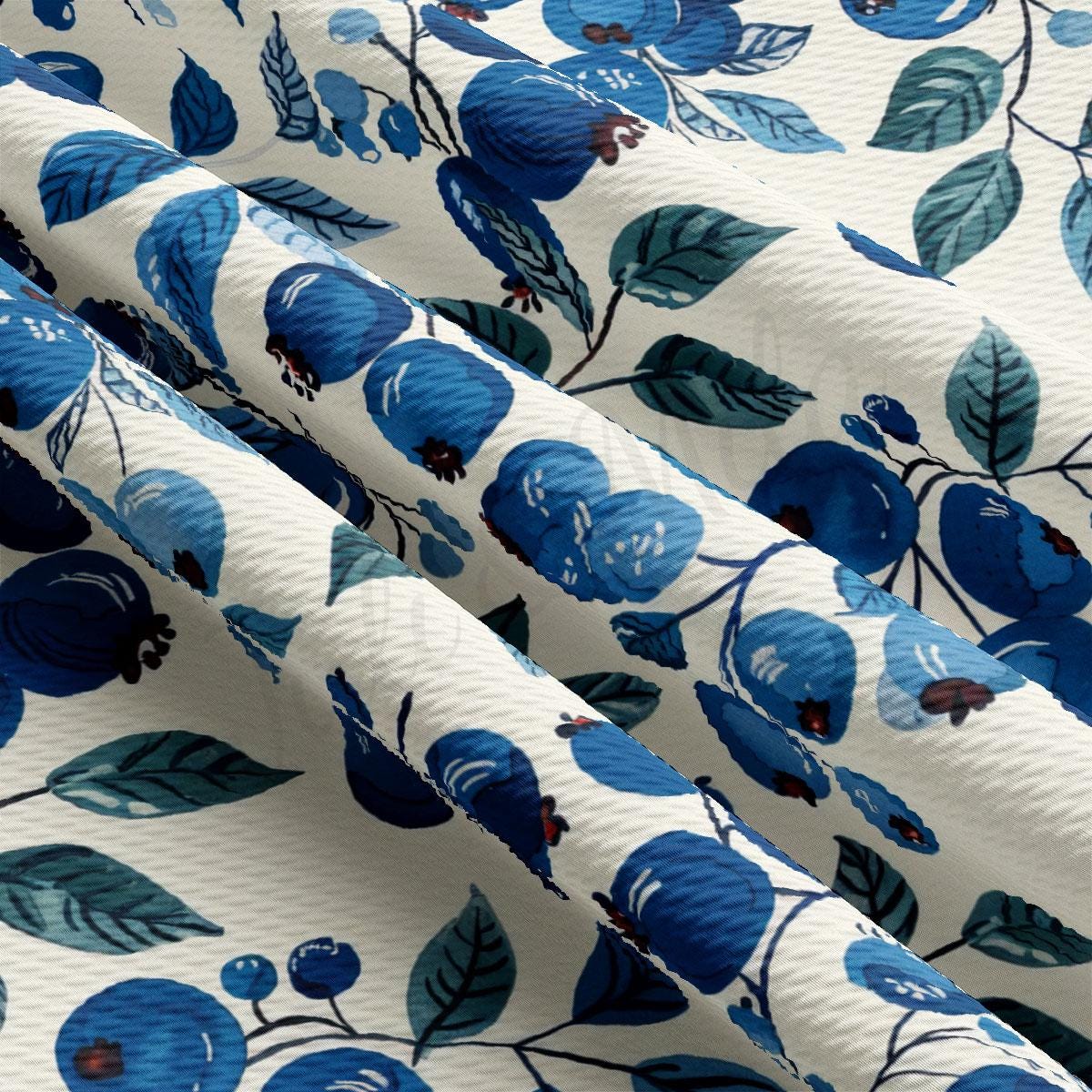 a close up of a blue and white flowered curtain