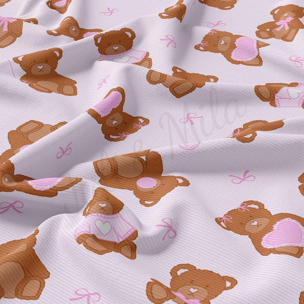 a white fabric with brown teddy bears on it