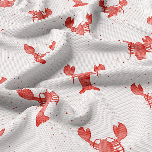 a close up of a red and white fabric with lobsters on it