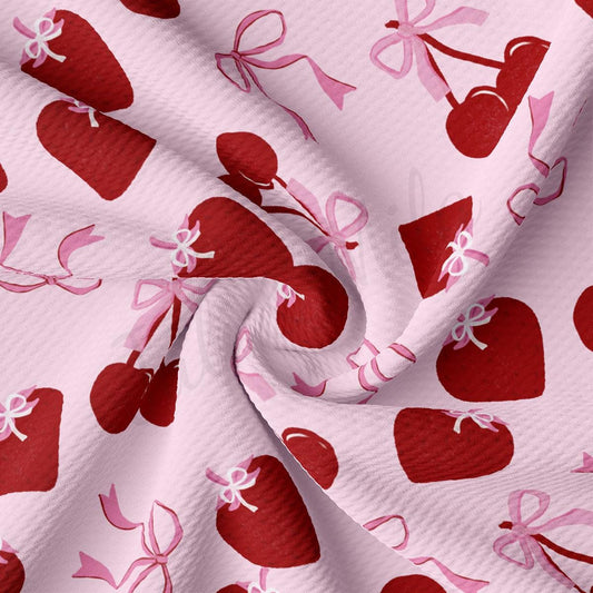 a pink and red fabric with hearts on it