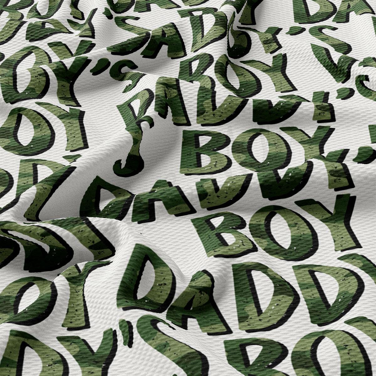 a close up of a fabric with green letters on it