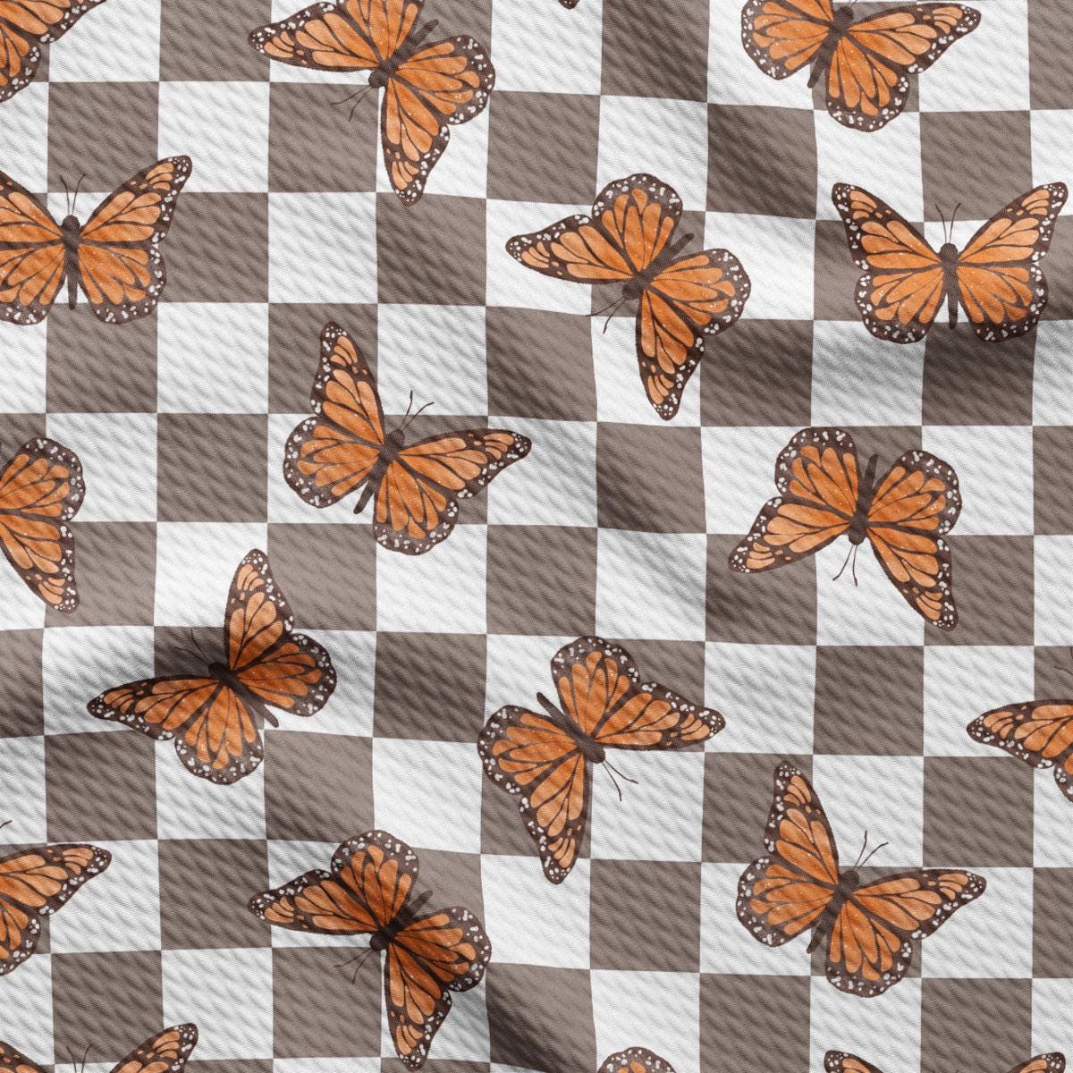 a checkerboard pattern with orange butterflies on it