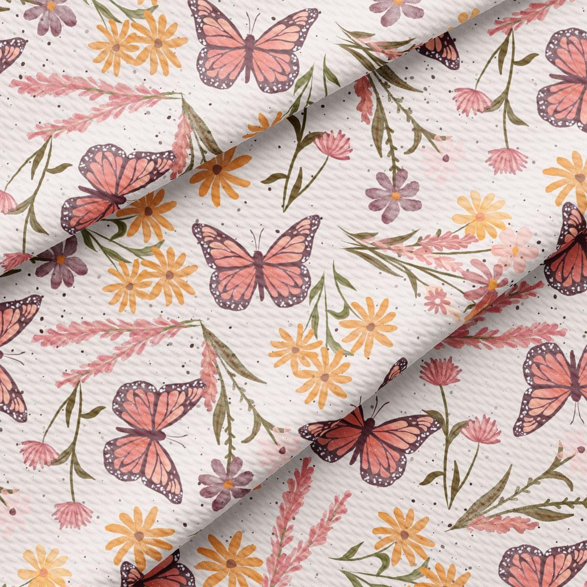 a close up of a flower and butterfly print fabric