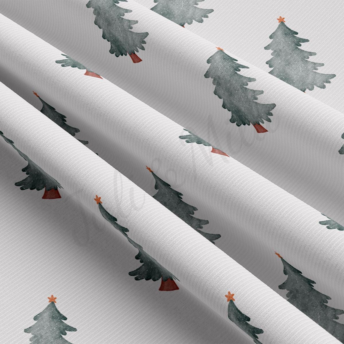 a close up of a white wrapping paper with trees on it