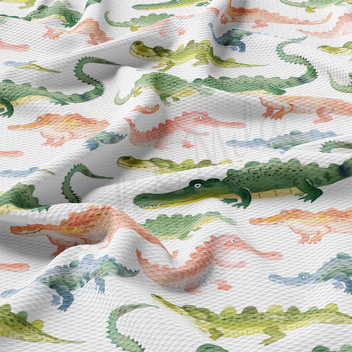 a close up of a pattern of alligators on a white background