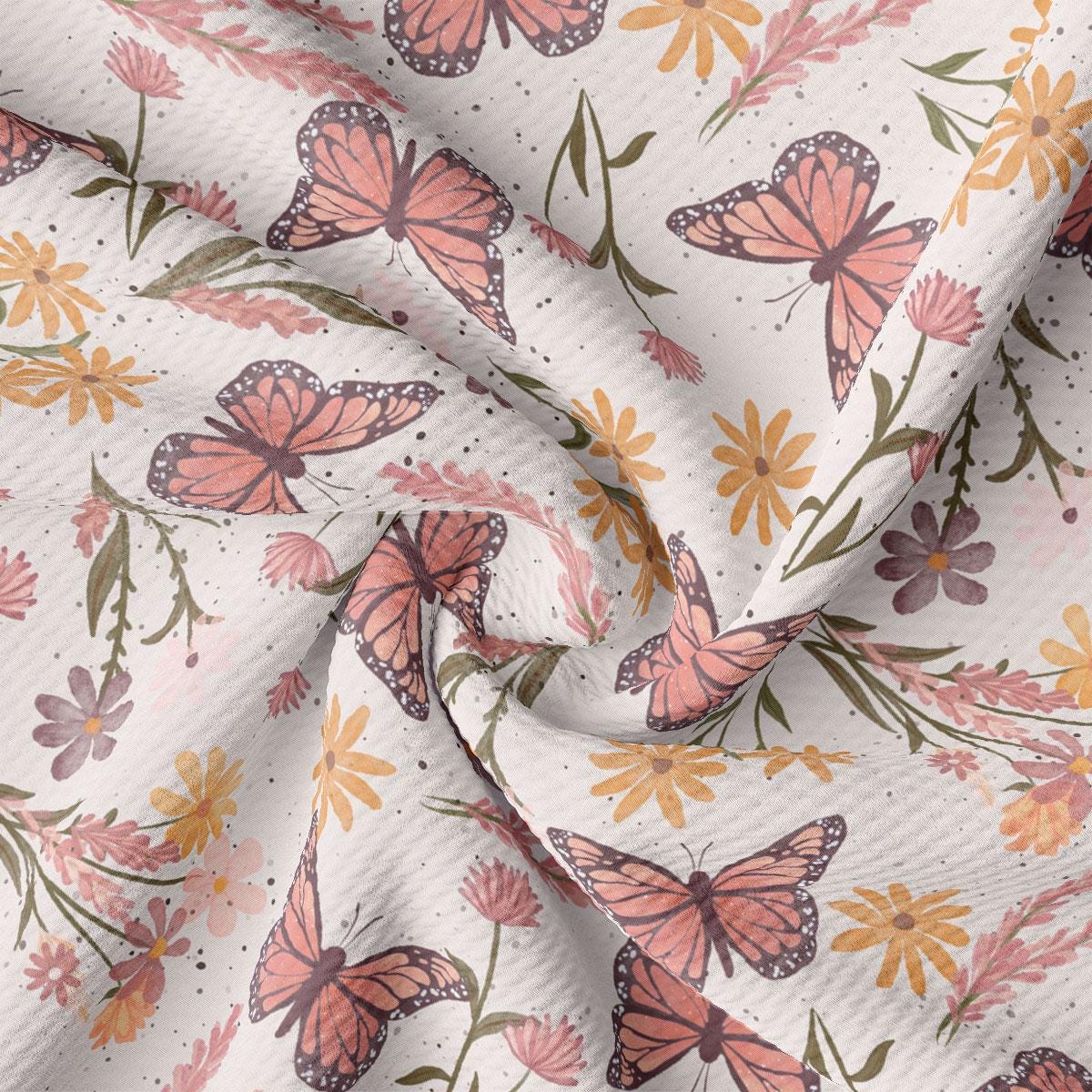 a close up of a pink and yellow butterfly print fabric