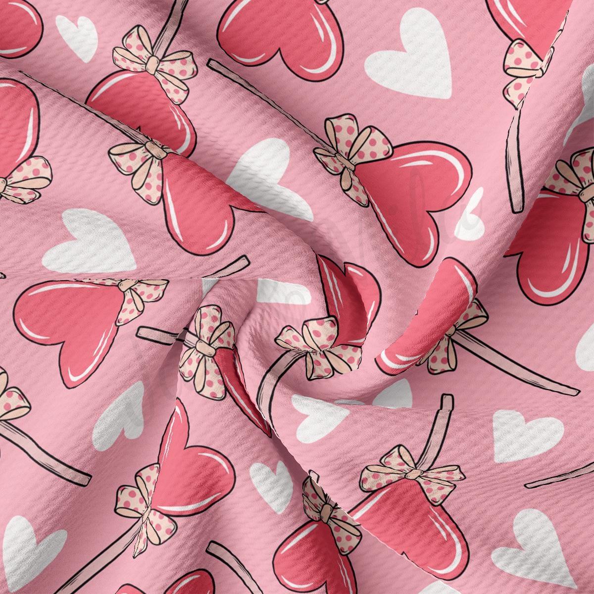 a pink fabric with hearts on it