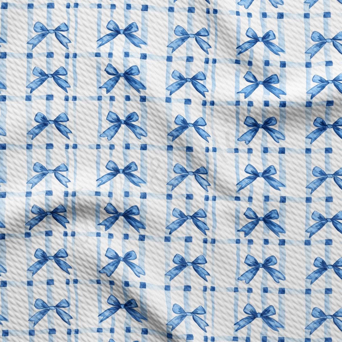 a blue and white checkered fabric with bows