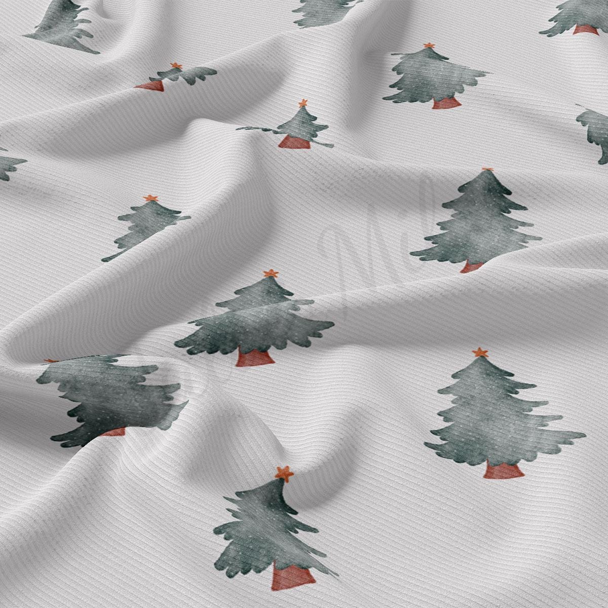 a close up of a white fabric with trees on it