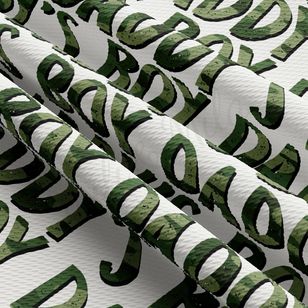 a close up of a pattern of green and white letters