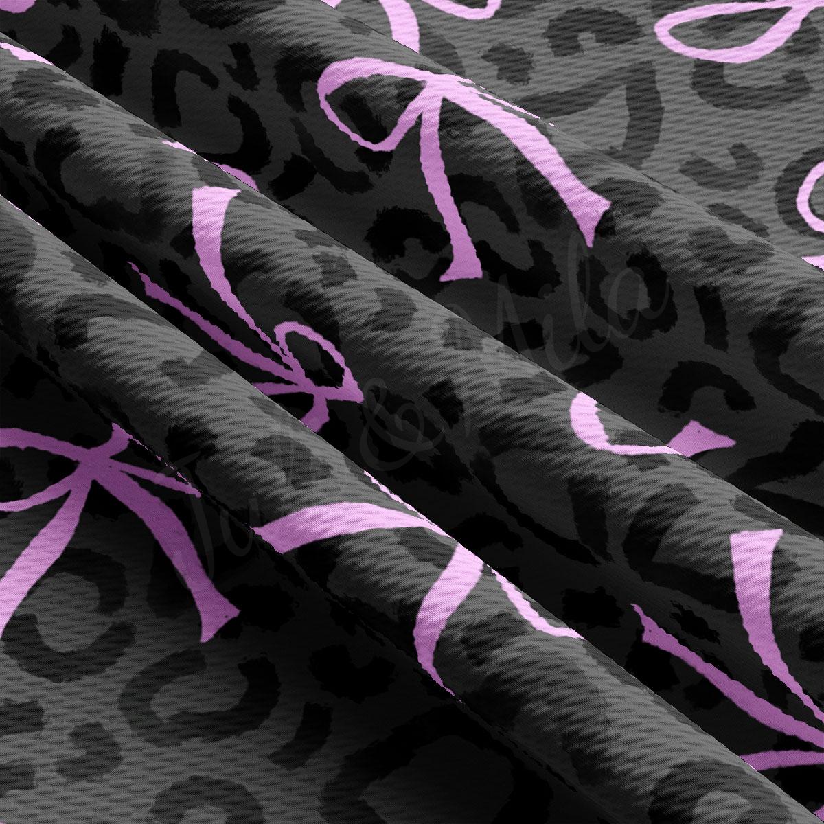 a close up of a purple and black fabric