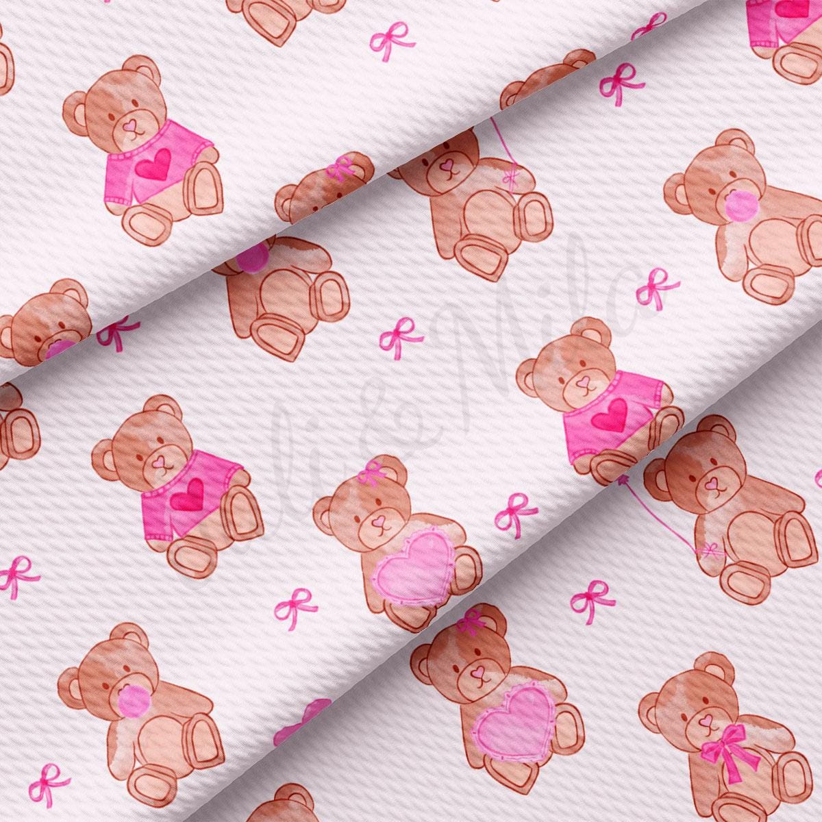 a pink and brown teddy bear pattern on a white background