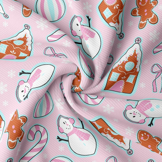 a pink fabric with a pattern of animals and snowflakes