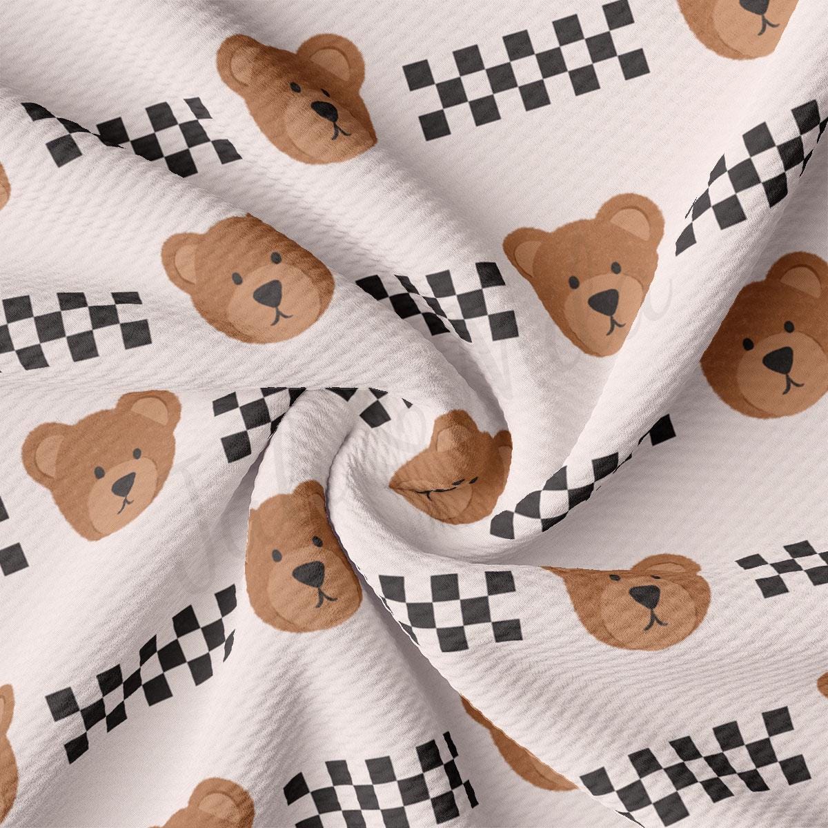 a teddy bear pattern on a white fabric