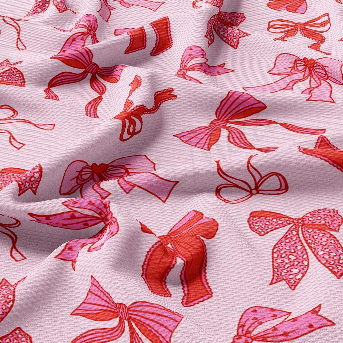 a close up of a pink and red fabric