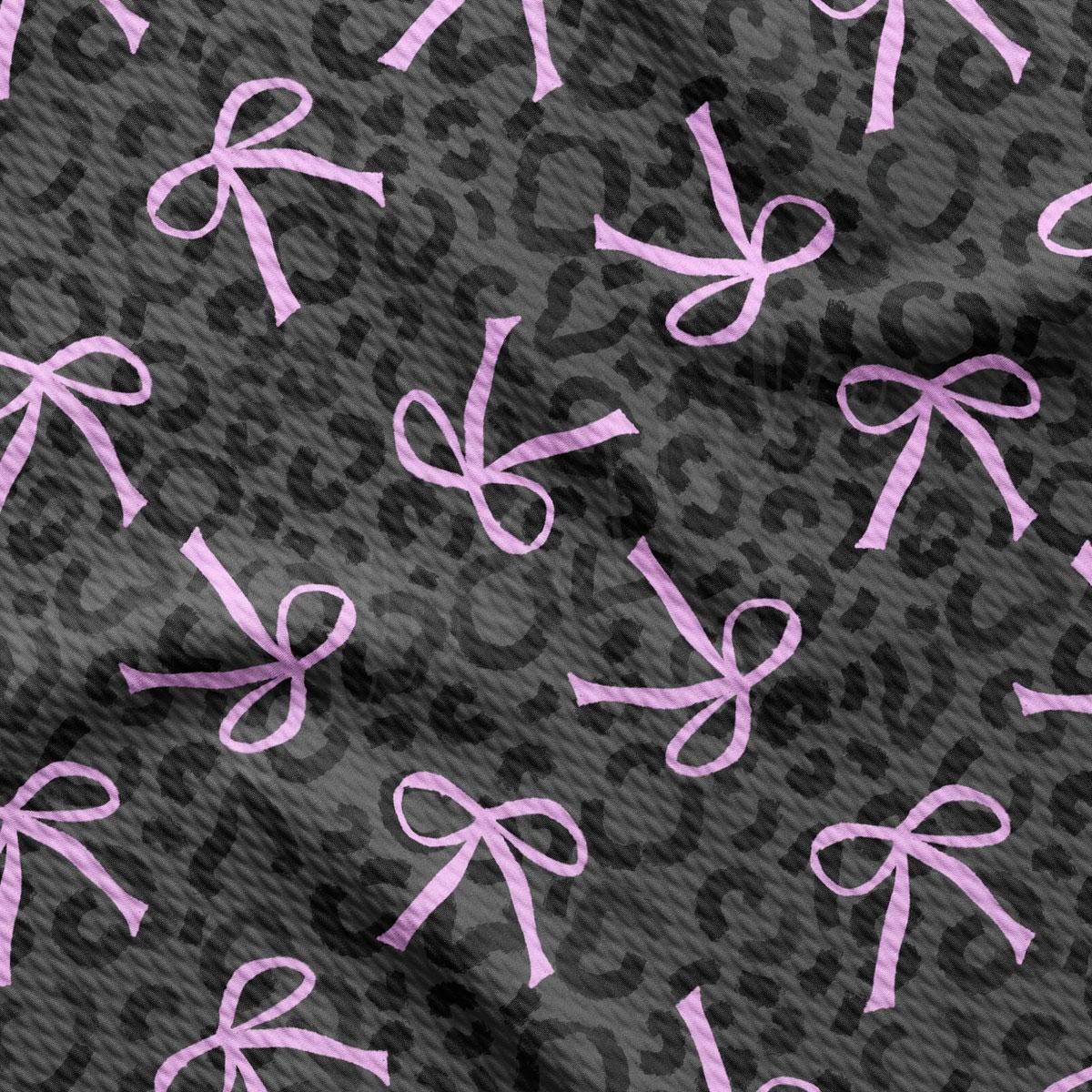 a pattern of pink bows on a black background