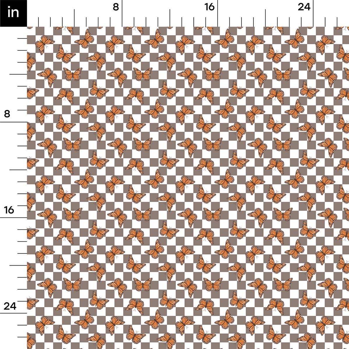 an orange and black checkered pattern with a ruler