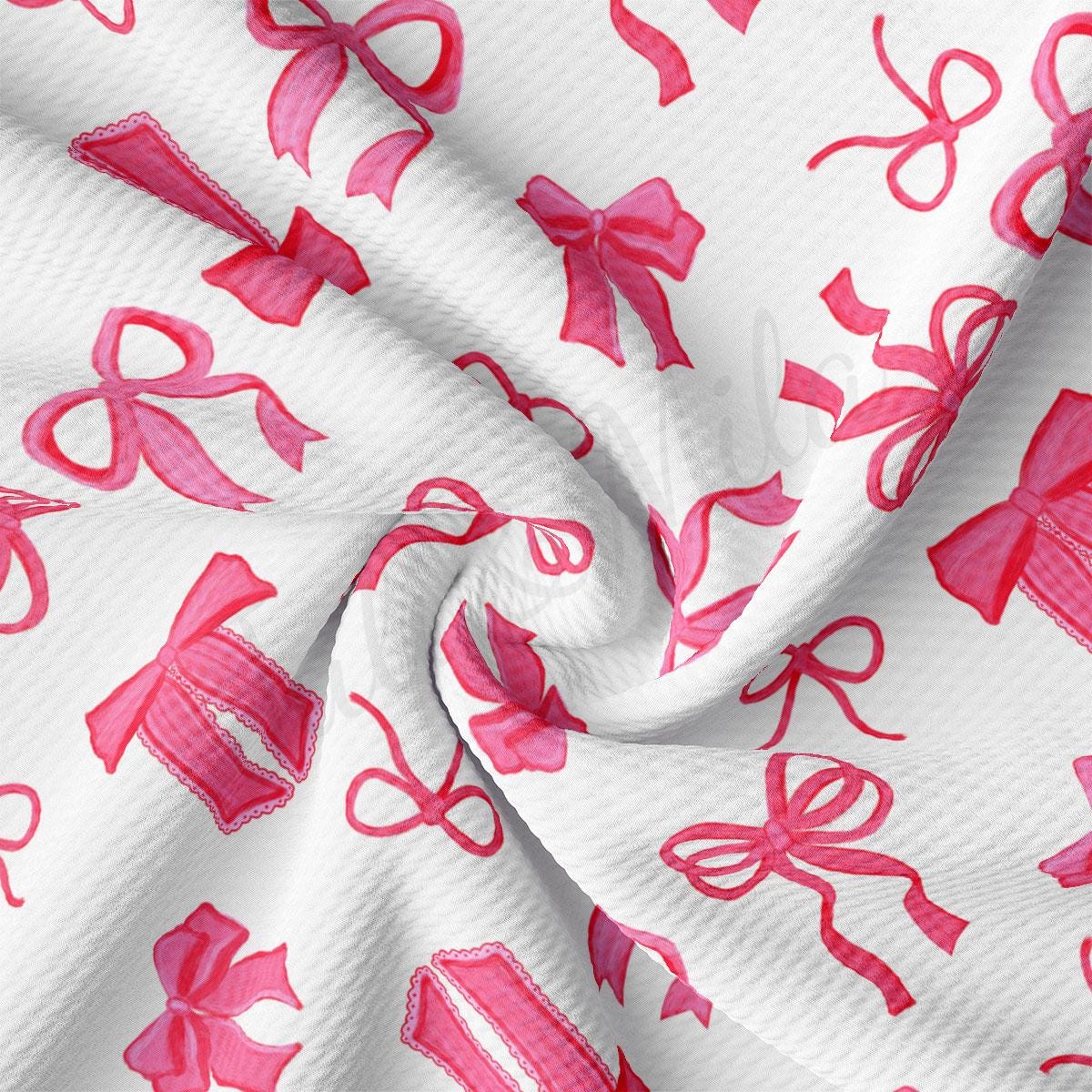 a close up of a pink and white fabric