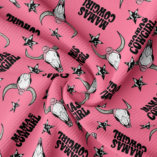 a pink fabric with black and white images on it