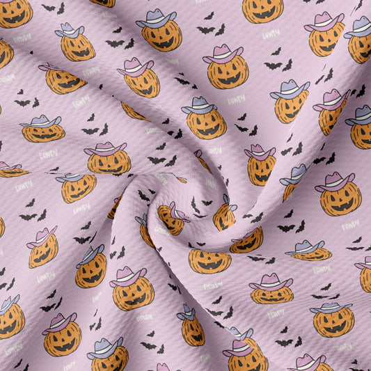 a pattern of pumpkins and bats on a pink background