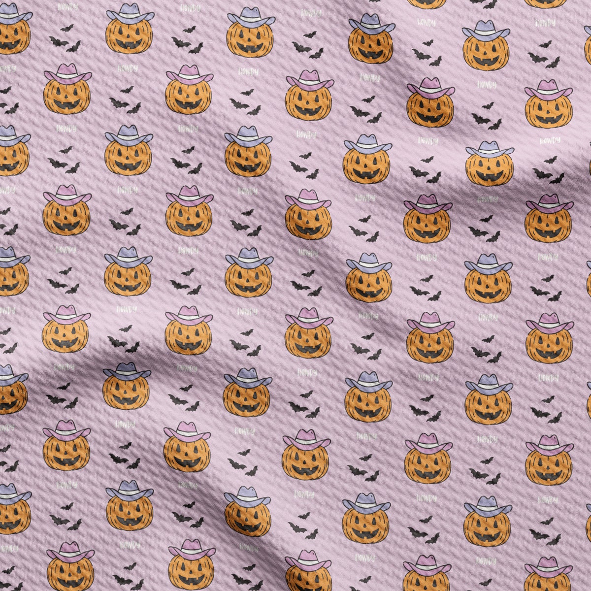 a pattern of pumpkins and bats on a pink background