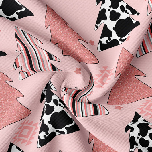 a pink and black cow print fabric