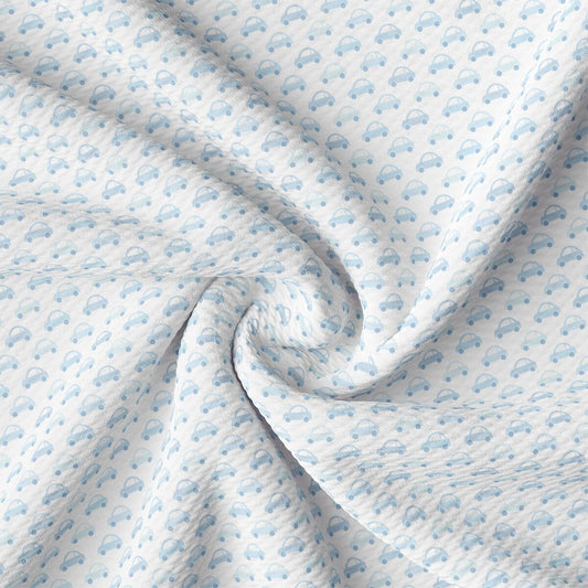 a close up of a blue and white cloud print fabric