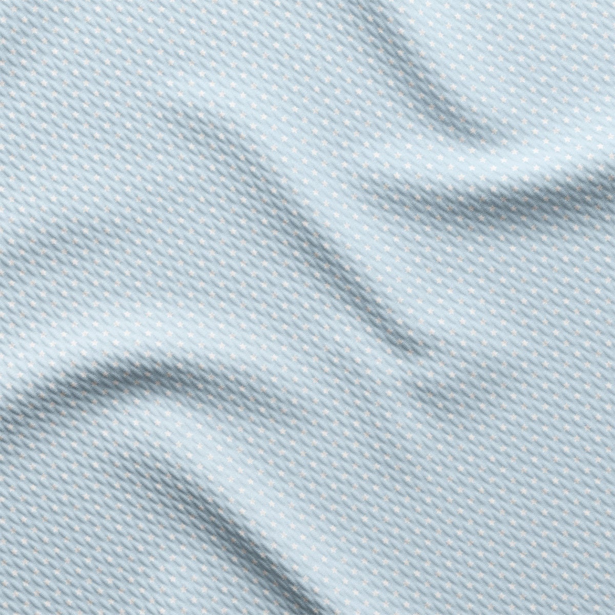 a close up view of a light blue fabric