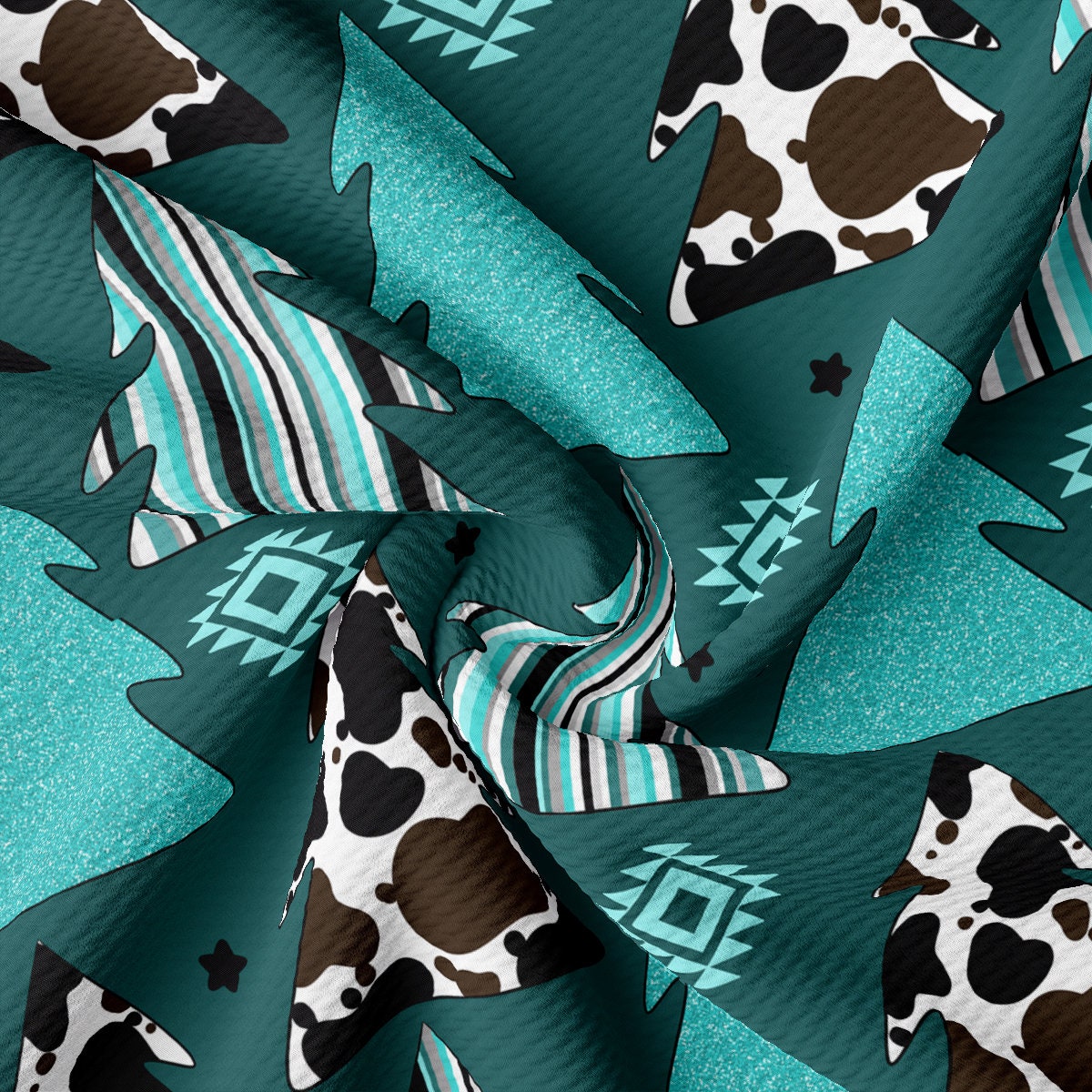 a cow pattern on a teal green background