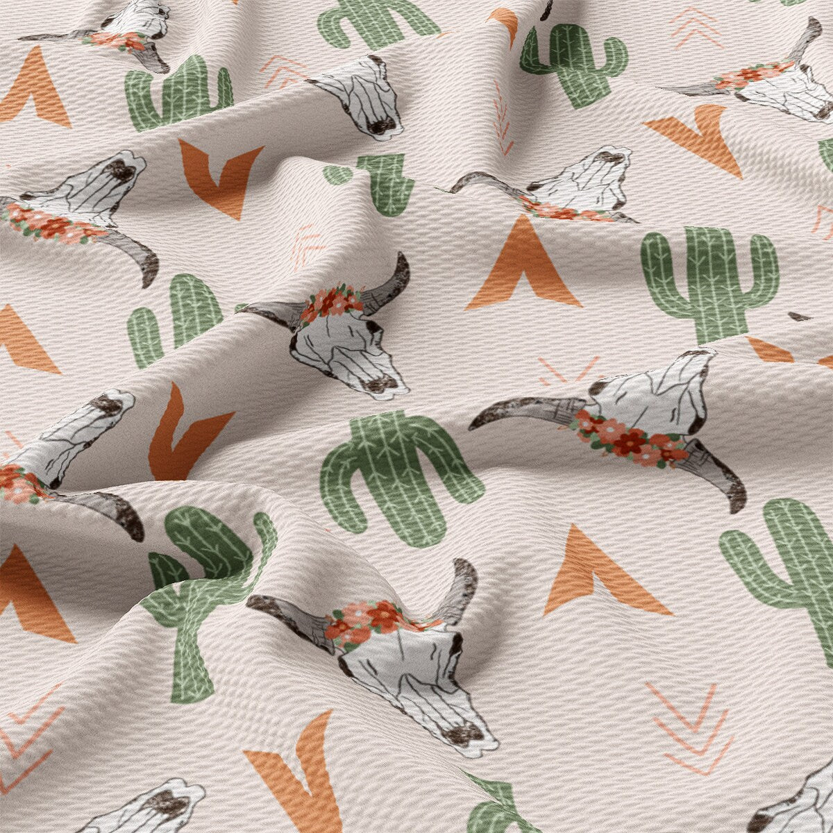 a white fabric with a cactus pattern on it