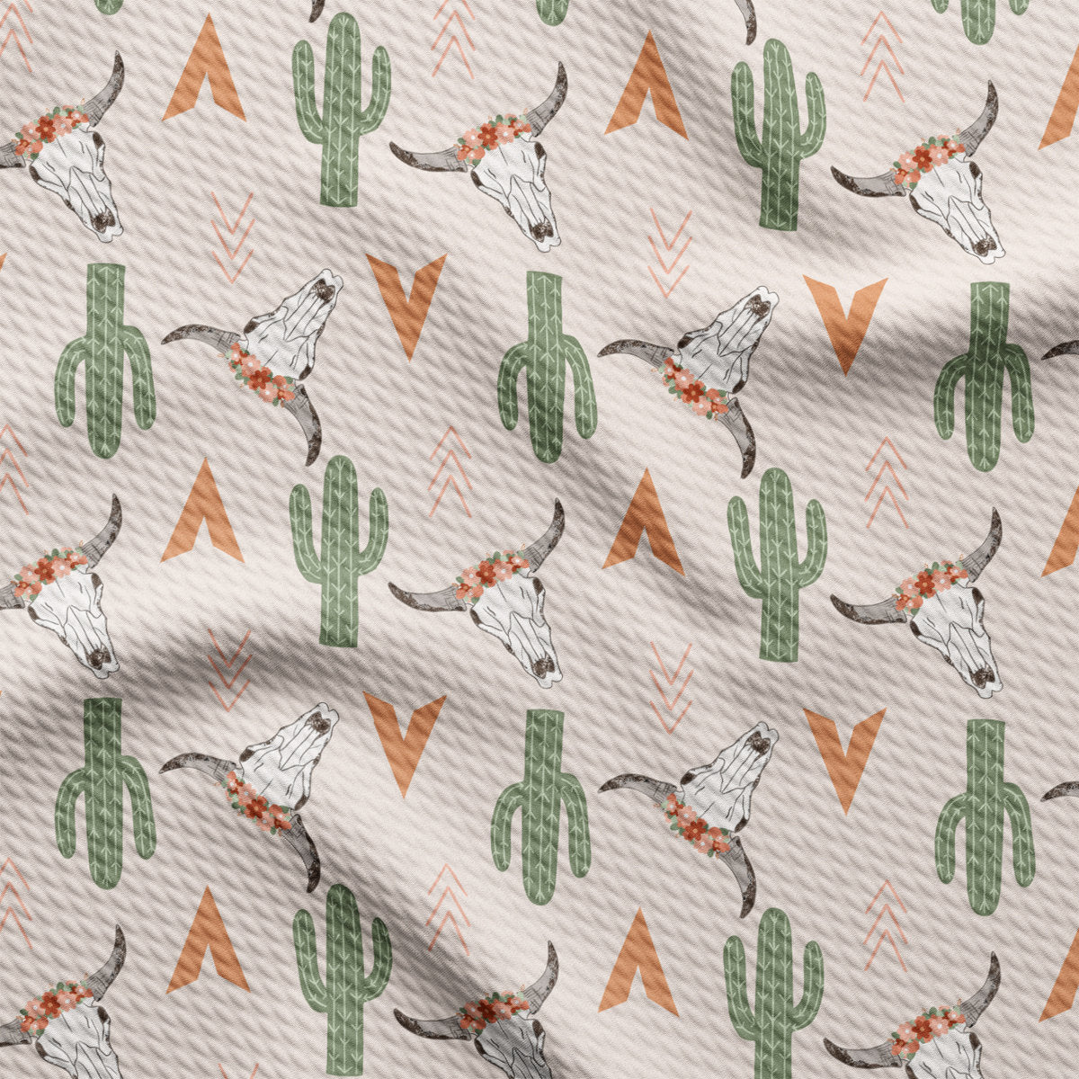 a white fabric with a pattern of a bull skull and cactus