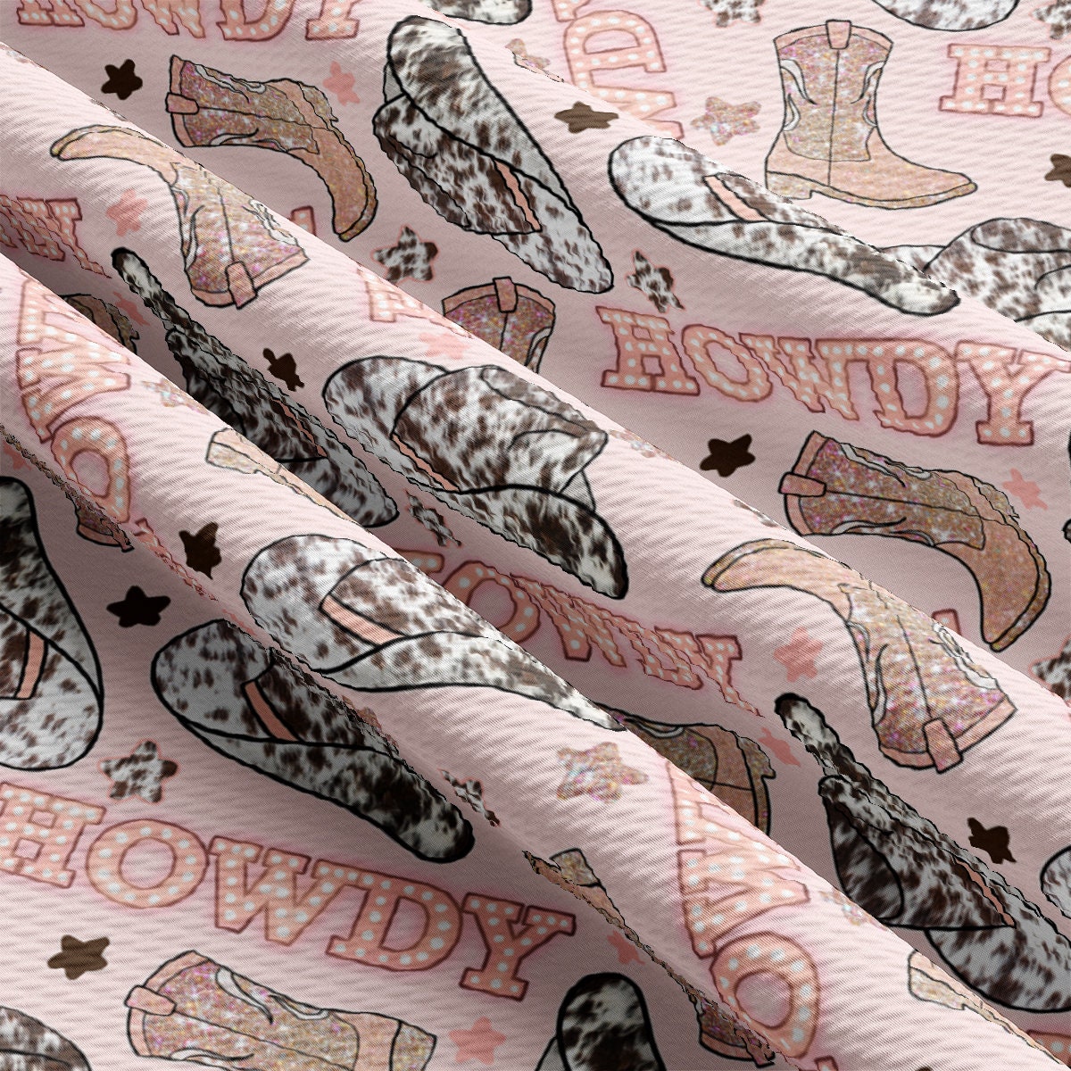 a pink fabric with cowboy boots on it