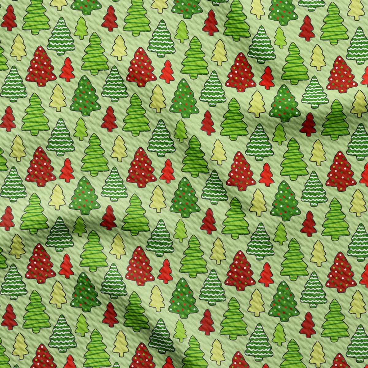 a pattern of christmas trees on a green background