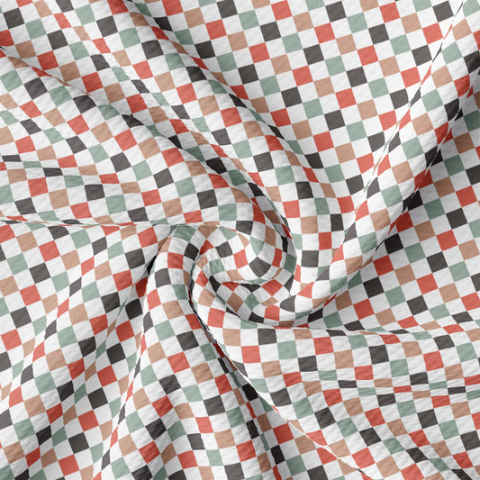 a multicolored checkered fabric with a circular design