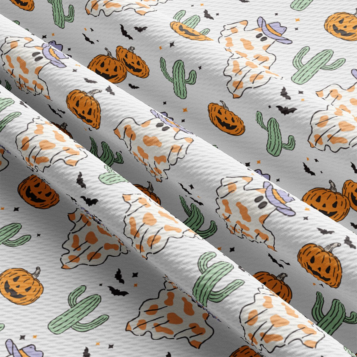 a pattern of pumpkins and cacti on a white background