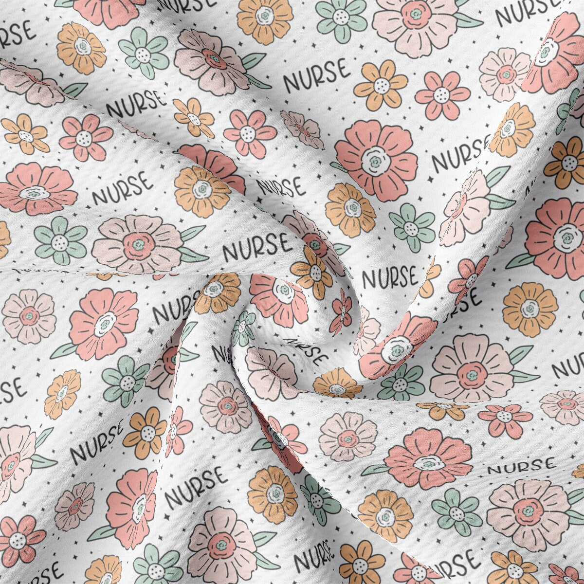 a close up of a white fabric with flowers on it