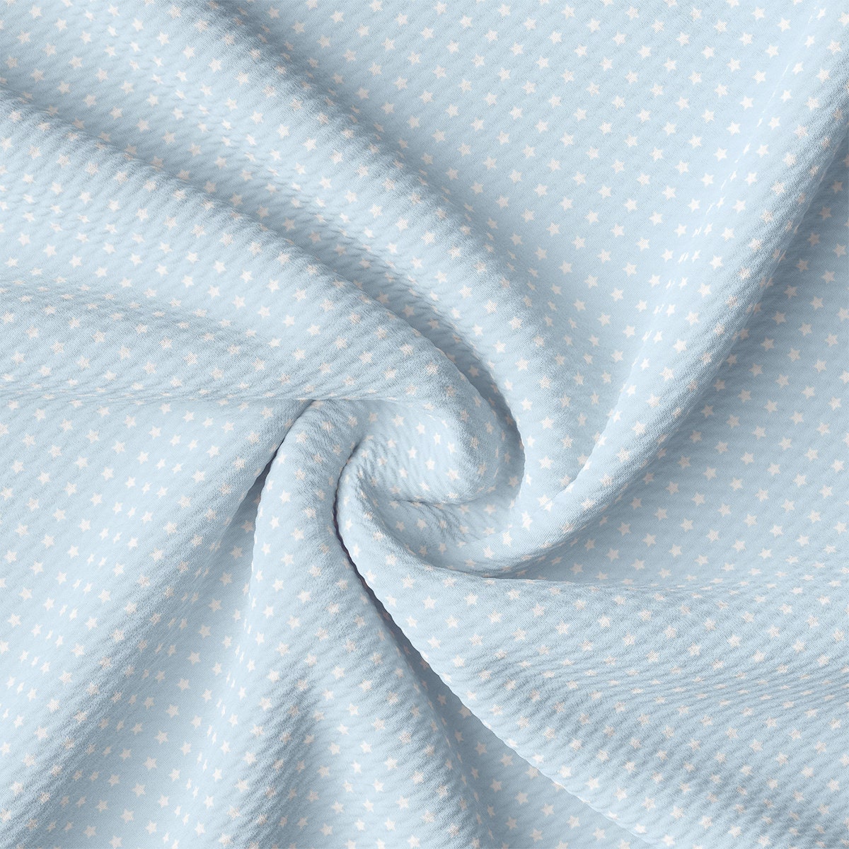 a close up of a blue and white polka dot fabric