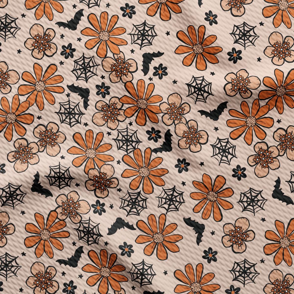 an orange and black flowery pattern on a white background