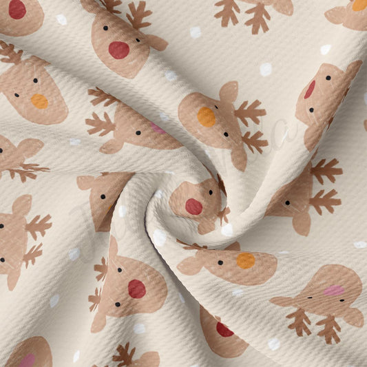 a close up of a fabric with reindeers on it