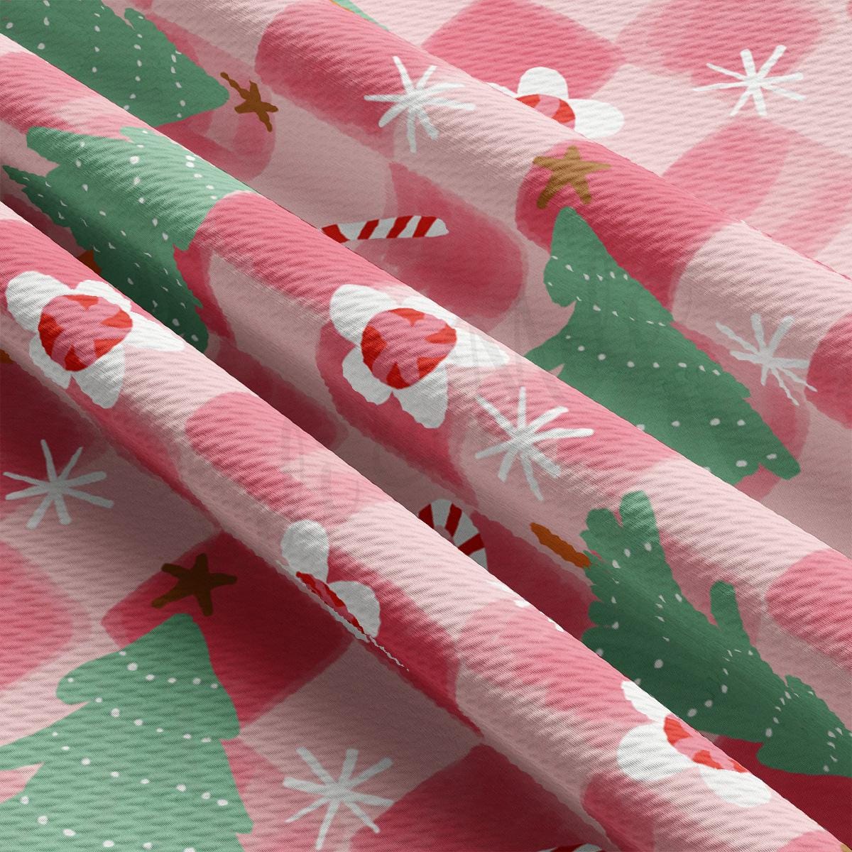 a close up of a pink christmas wrapping paper