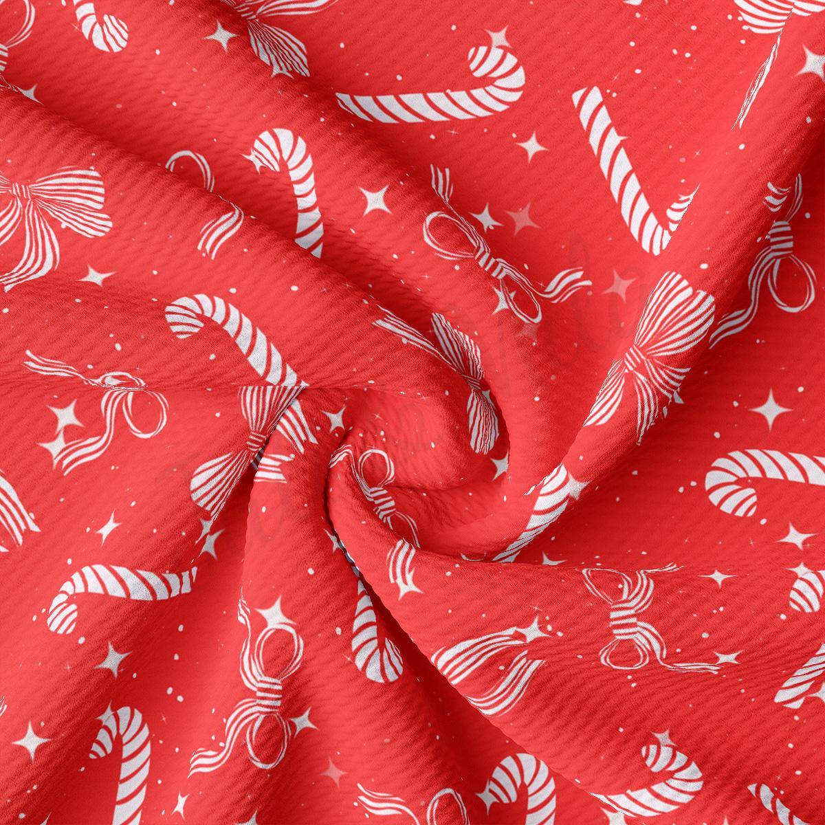 a red fabric with white stars and candy canes