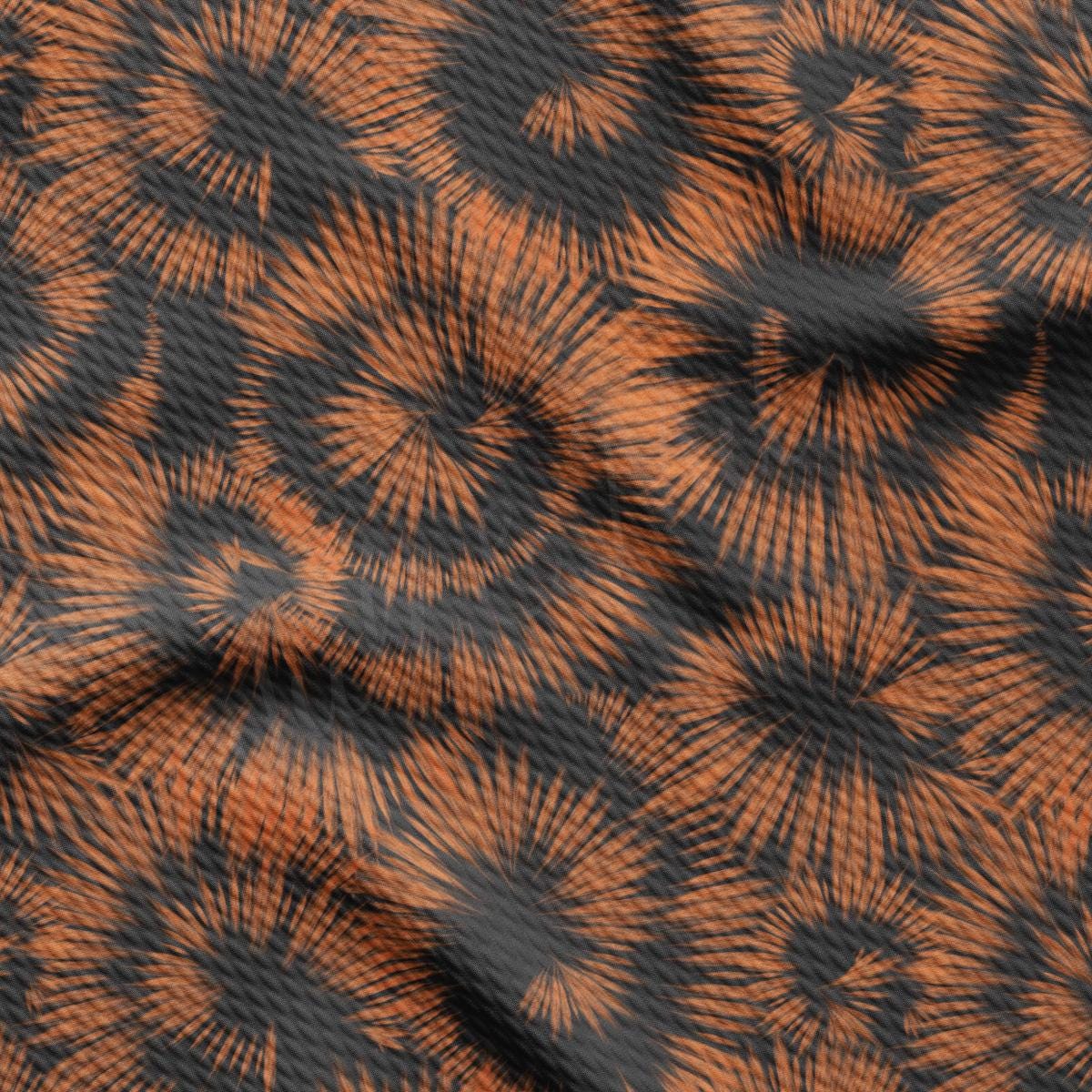 an orange and black pattern with a black background