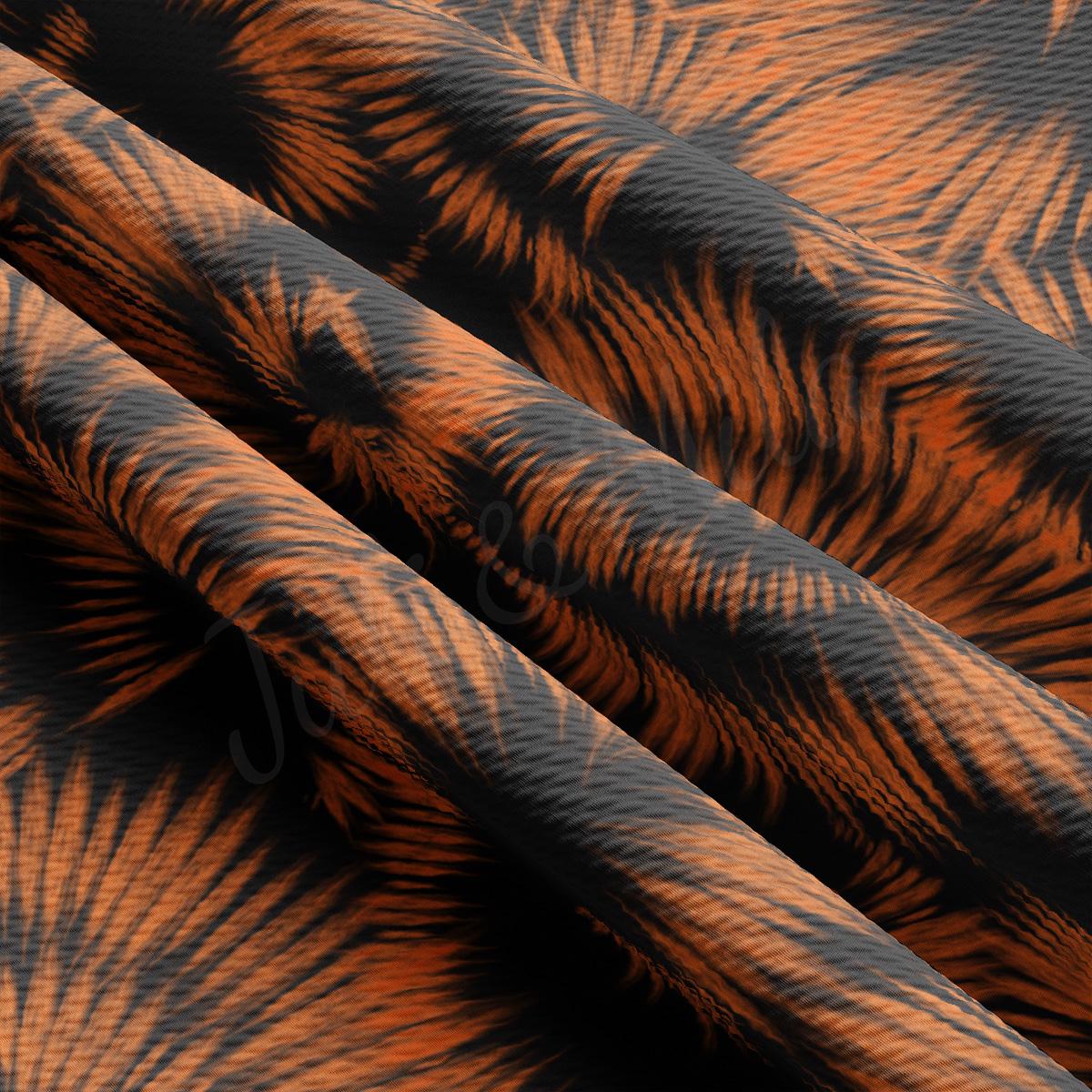 a close up of an orange and black pattern