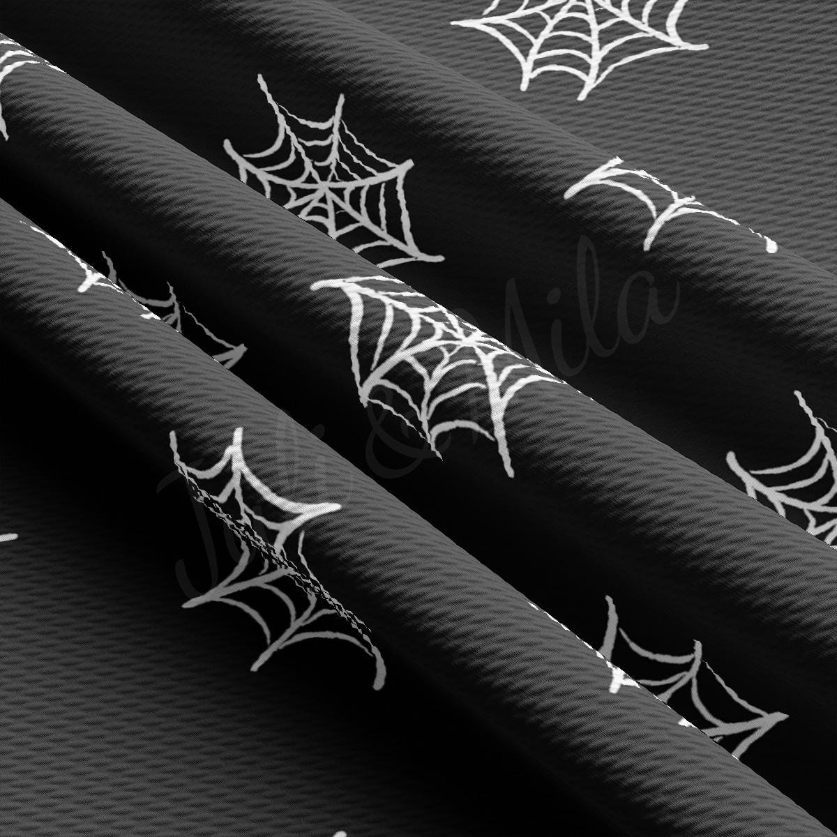 a black and white photo of spider webs