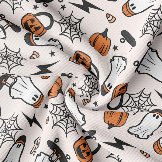 a white and orange halloween themed fabric