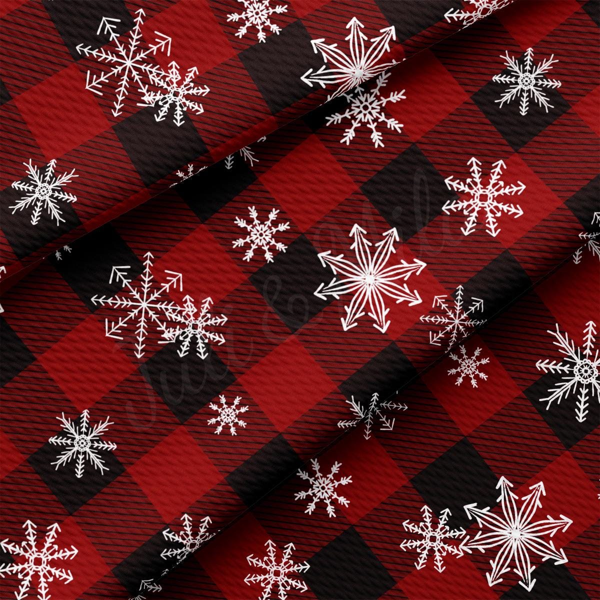 a red and black plaid with white snowflakes on it